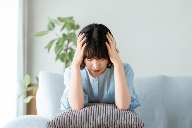 体調不良の女性